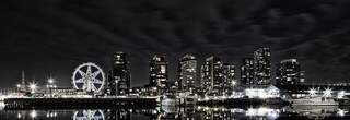 A photograph of a Melbourne skyline at night with city lights, Vince Russell on Unsplash